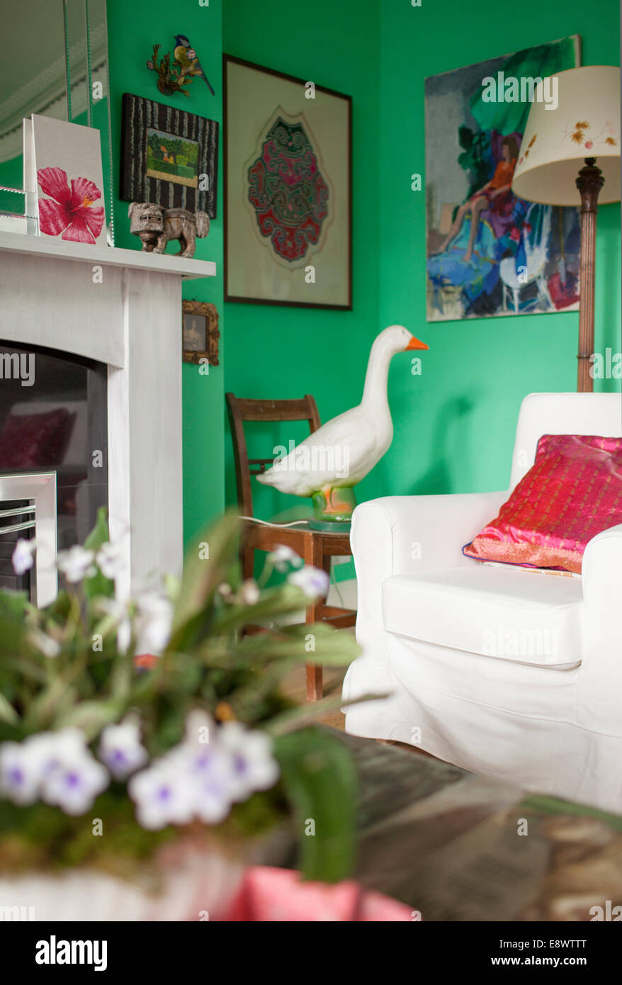 Duck statue in corner of green living room in the home of Laetitia Maklouf, writer. Stock Photo