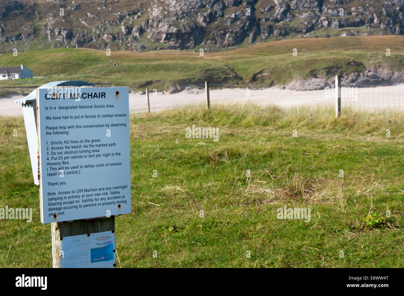 Sign on machair behind Cliff Beach or Tràigh na Clibhe on the west coast of the Isle of Lewis in the Outer Hebrides. Stock Photo