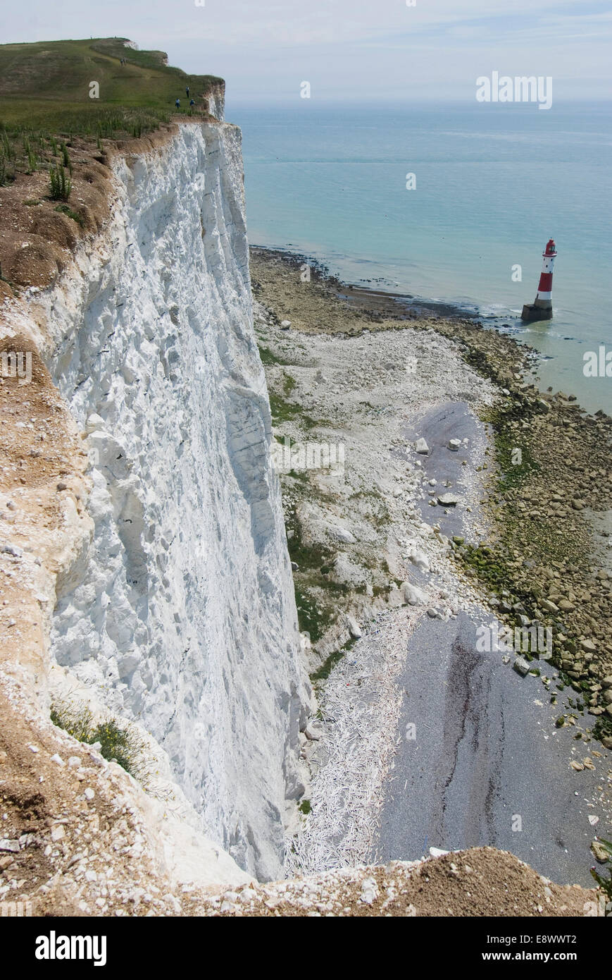 The White Cliffs of Beachy Head (dramatic cliff and famous suicide spot) with lighthouse beyond, East Sussex, England Stock Photo