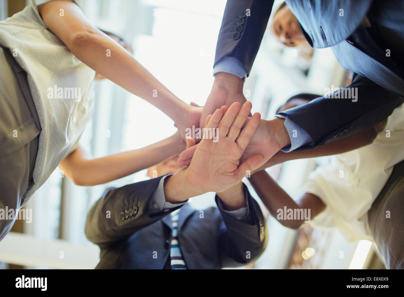 Business people putting hands together Stock Photo