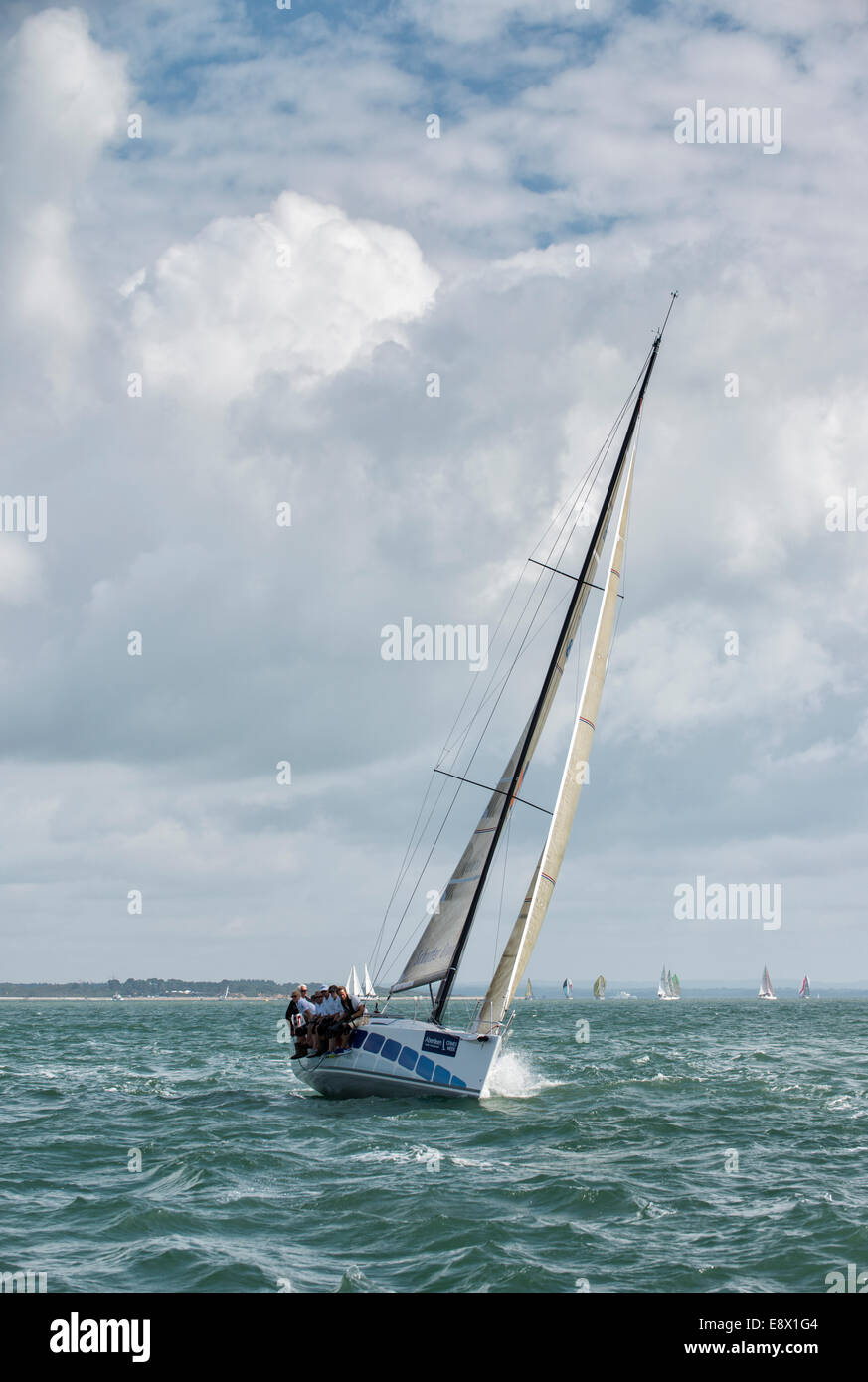 Racing Yacht competing in the 2014 Cowes Week Regatta in the Solent off the Isle of Wight Stock Photo