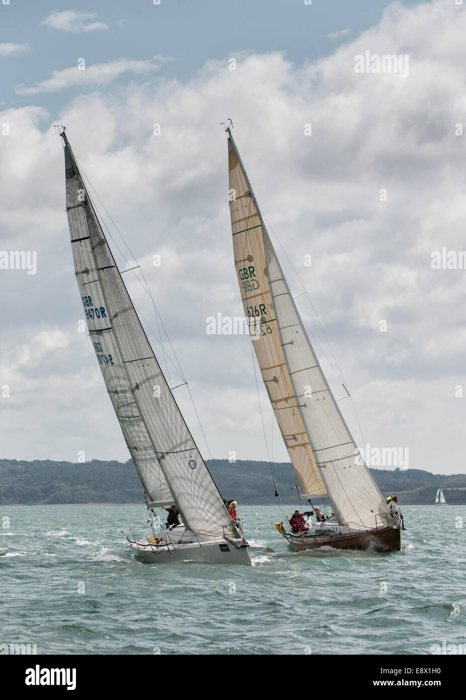 Close racing between yacht Old Mother Gun sail number GBR626R and Banshee sail number GBR9470R during the Cowes Week Regatta Stock Photo