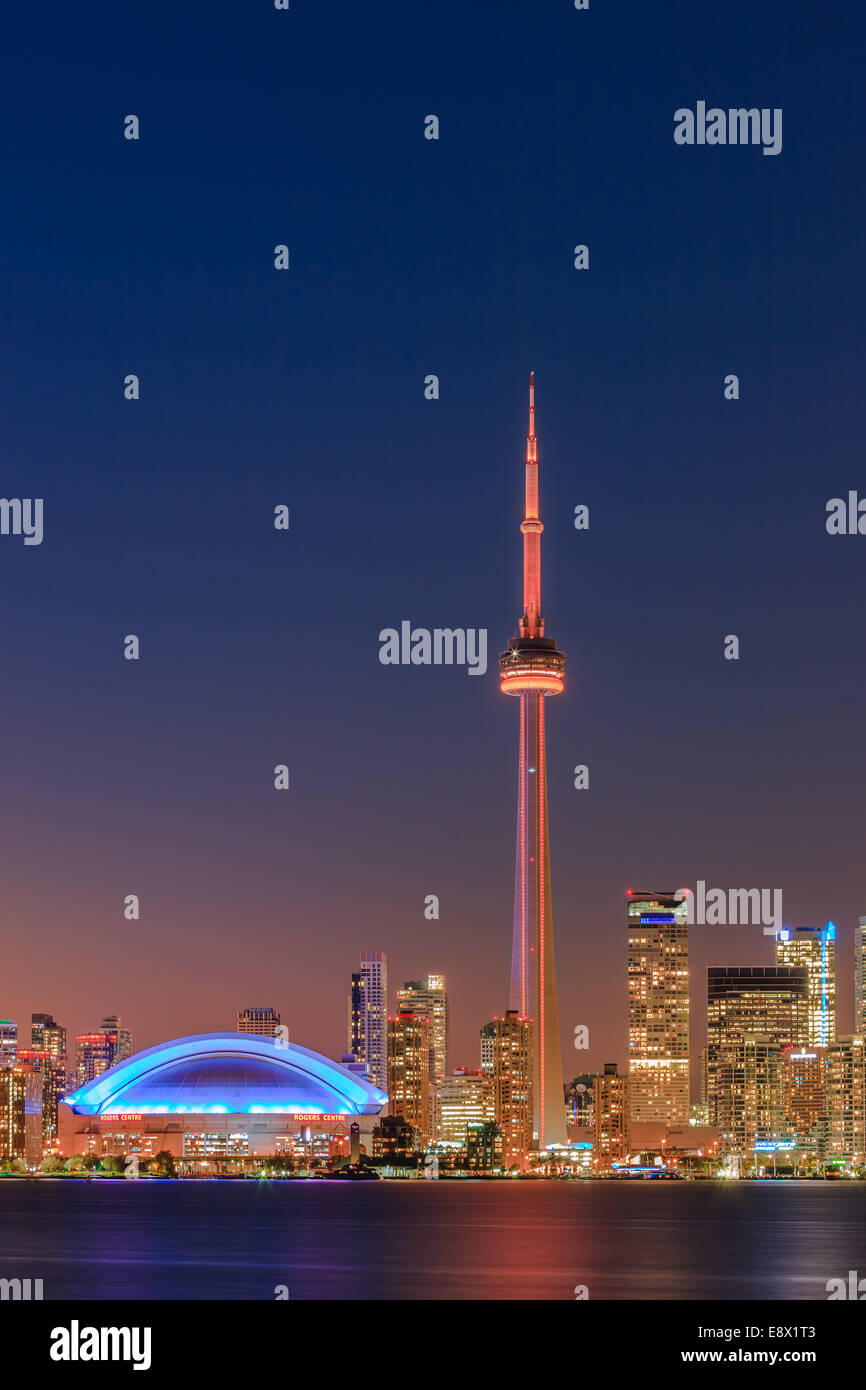 Famous Toronto Skyline with the CN Tower and Rogers Centre after sunset taken from the Toronto Islands. Stock Photo