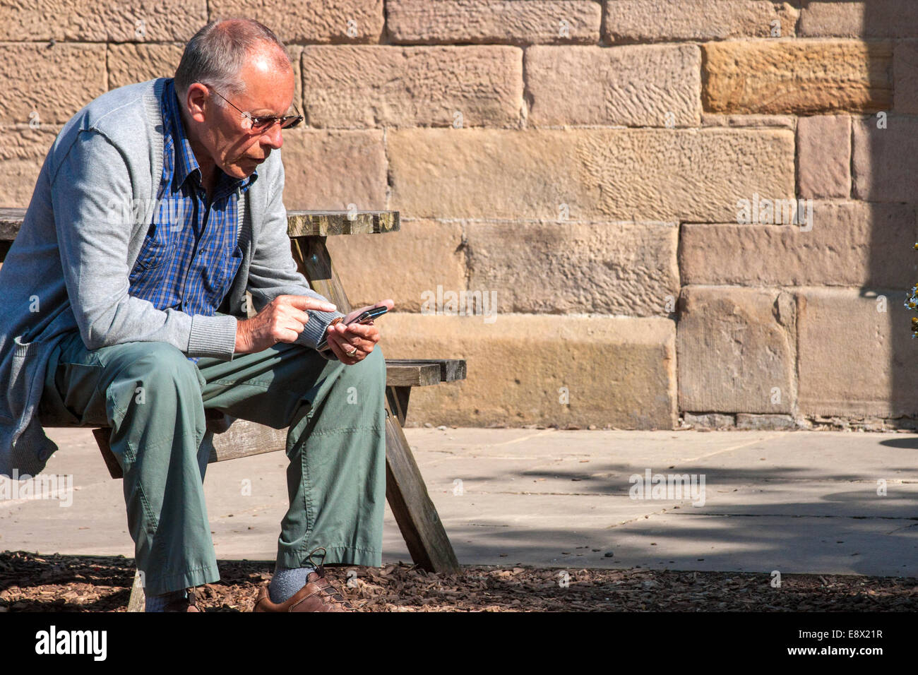 Senior using mobile phone Stock Photo