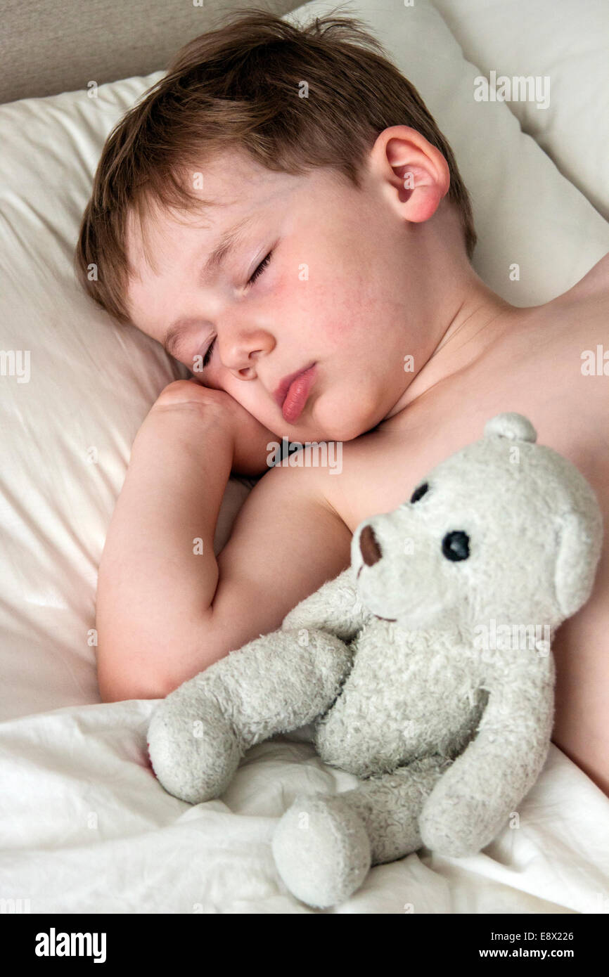 Young Boy asleep in bed, close-up Stock Photo