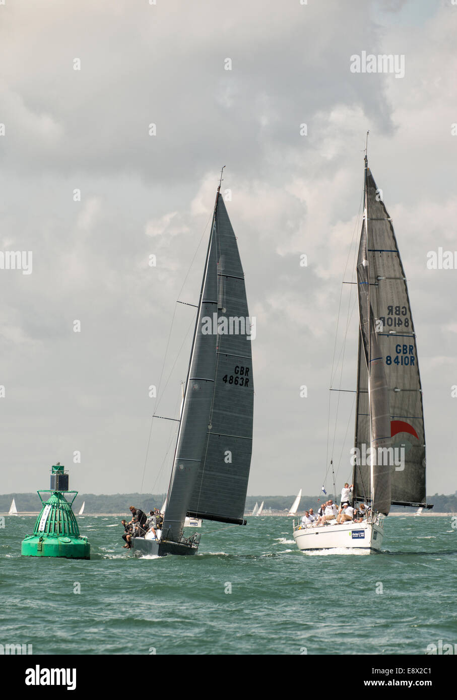 Racing Yacht Yes! a Corby 36 sail number GBR4863R  rounds the Salt Mead Buoy ahead of GBR8410R and Elan 410 during Cowes Week Stock Photo