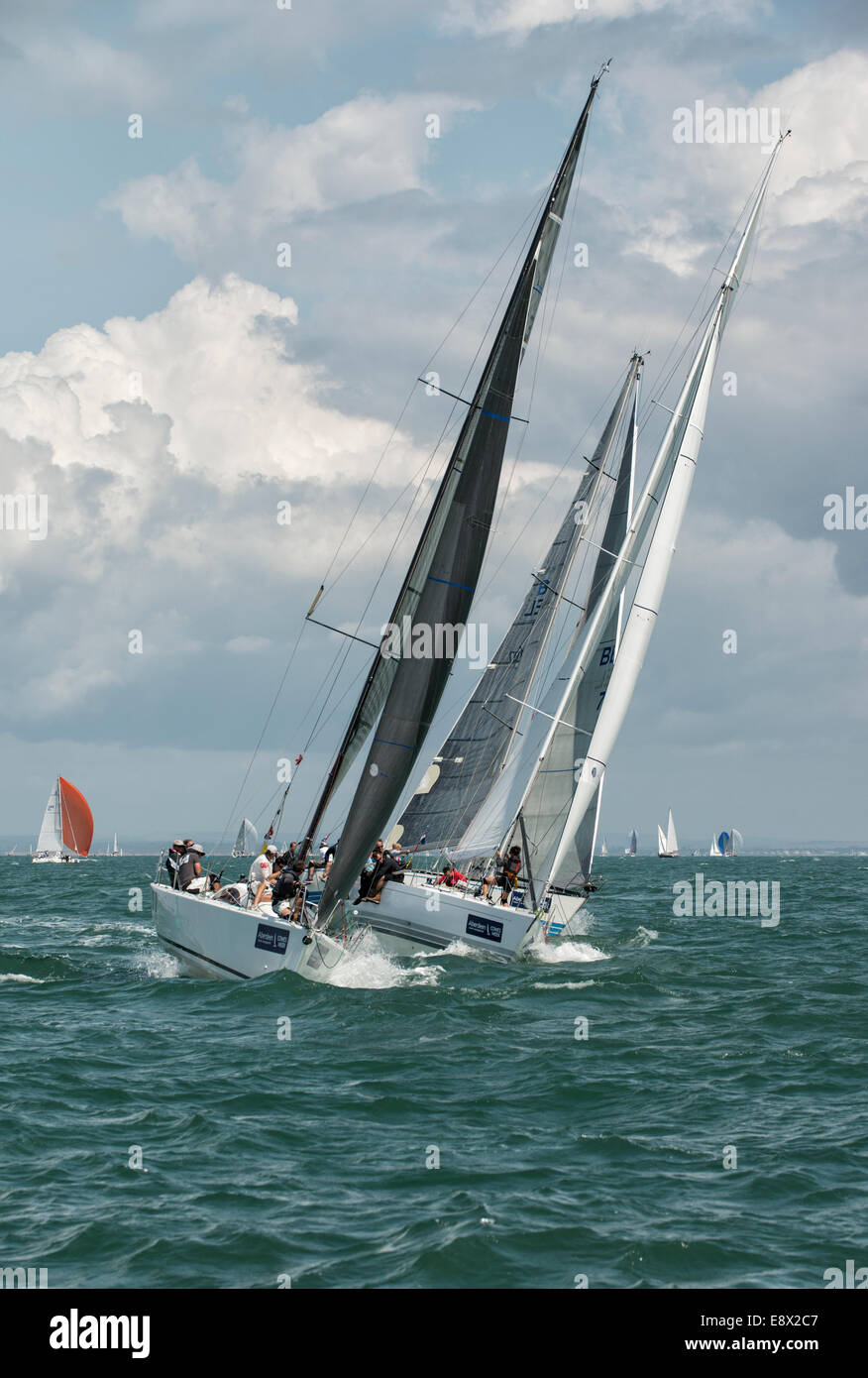 Close racing during Cowes Week Regatta saw these three yachts fighting for position in the Solent in the southern United Kingdom Stock Photo