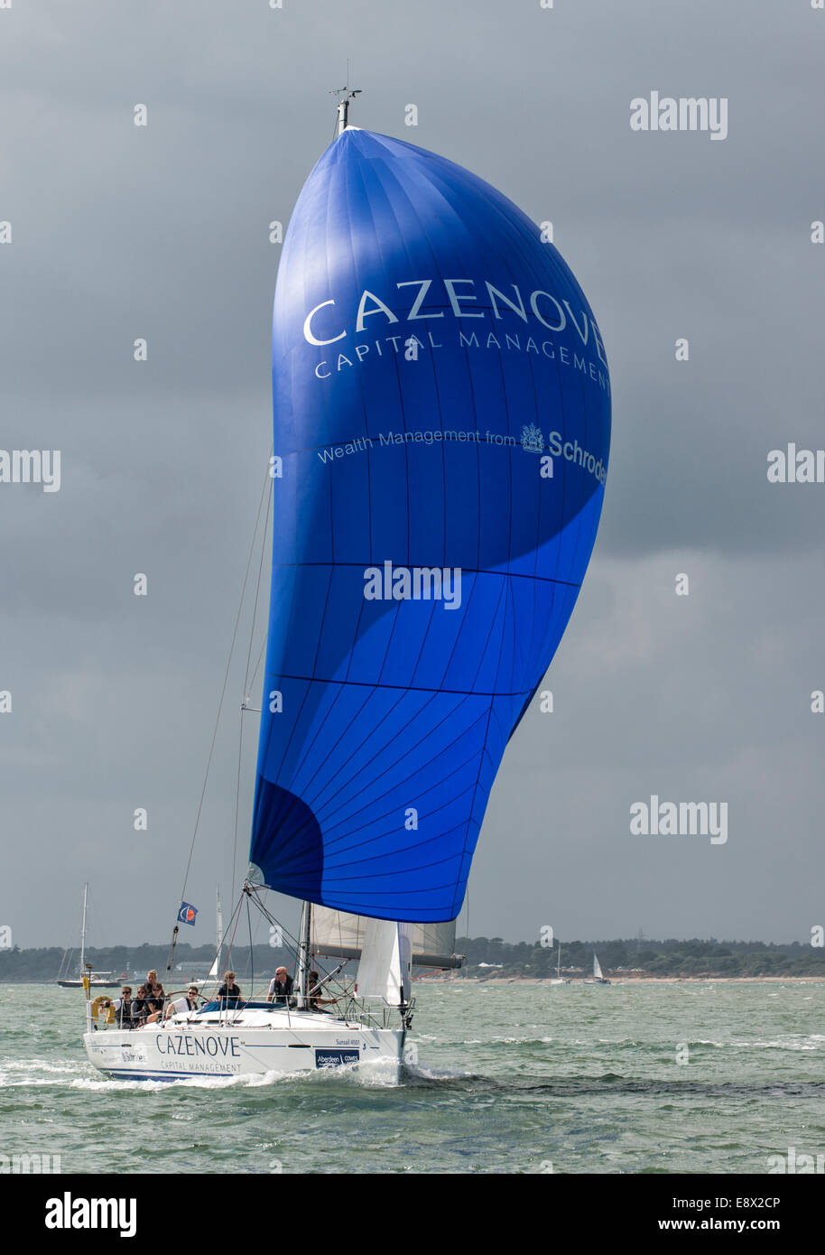 Lovely blue spinnaker on this Match First 40 racing yacht as it competes during the Cowes Week regatta in the Solent Stock Photo