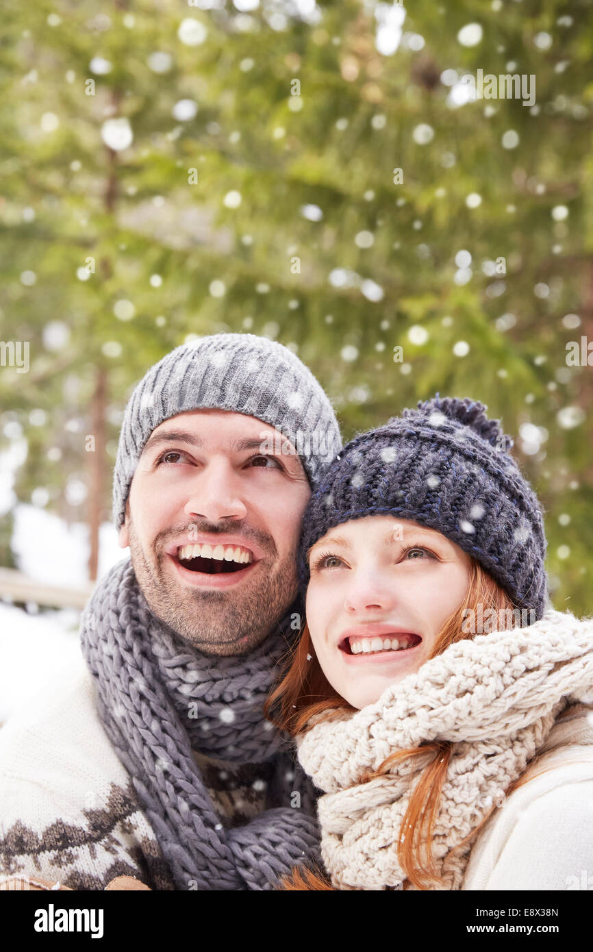 Couple admiring snow together Stock Photo