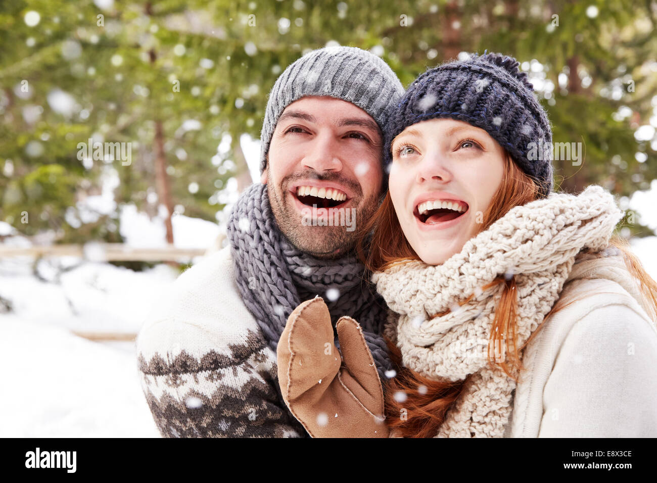 Couple admiring the snow together Stock Photo