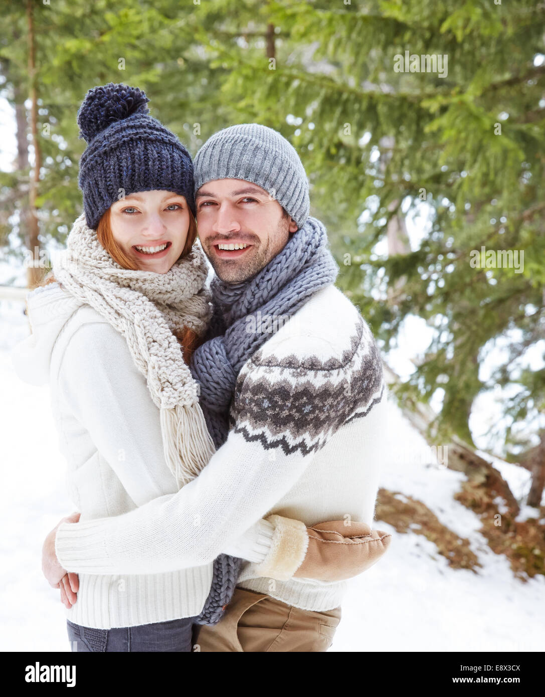 Couple hugging in the snow Stock Photo - Alamy