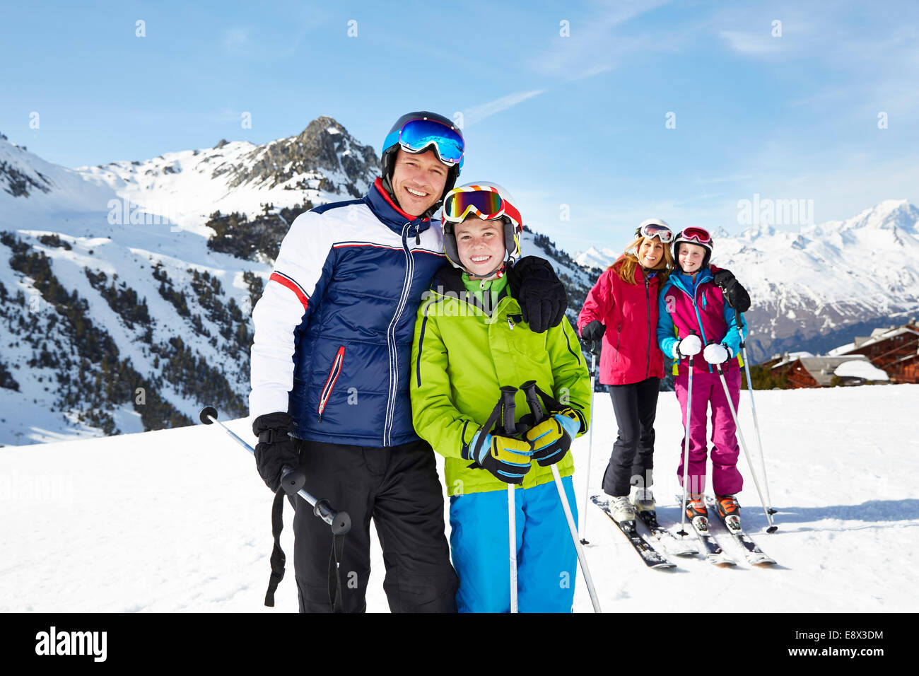Father and son skiing together Stock Photo