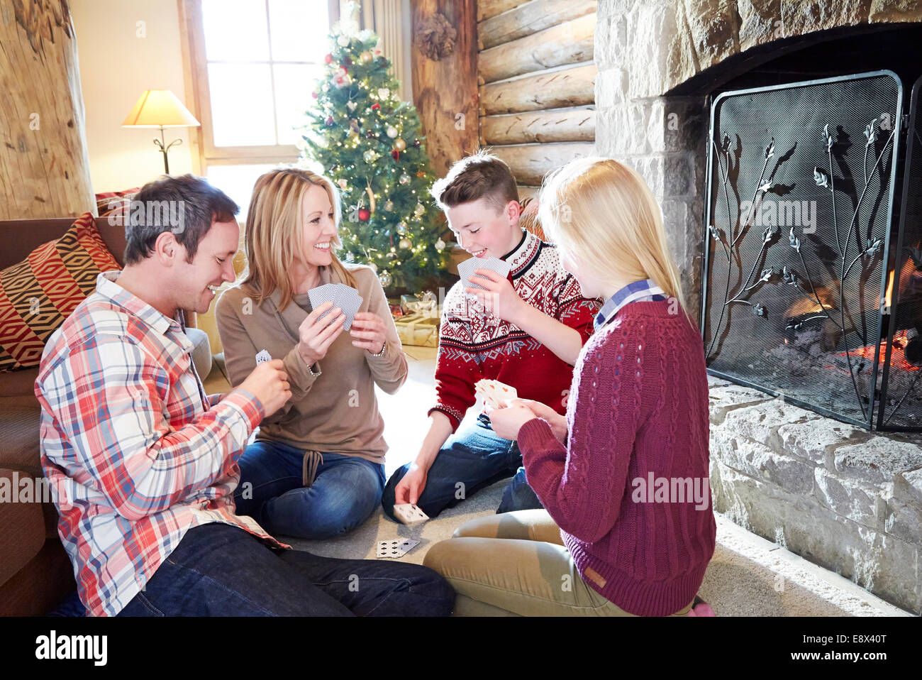 Family playing card game together Stock Photo