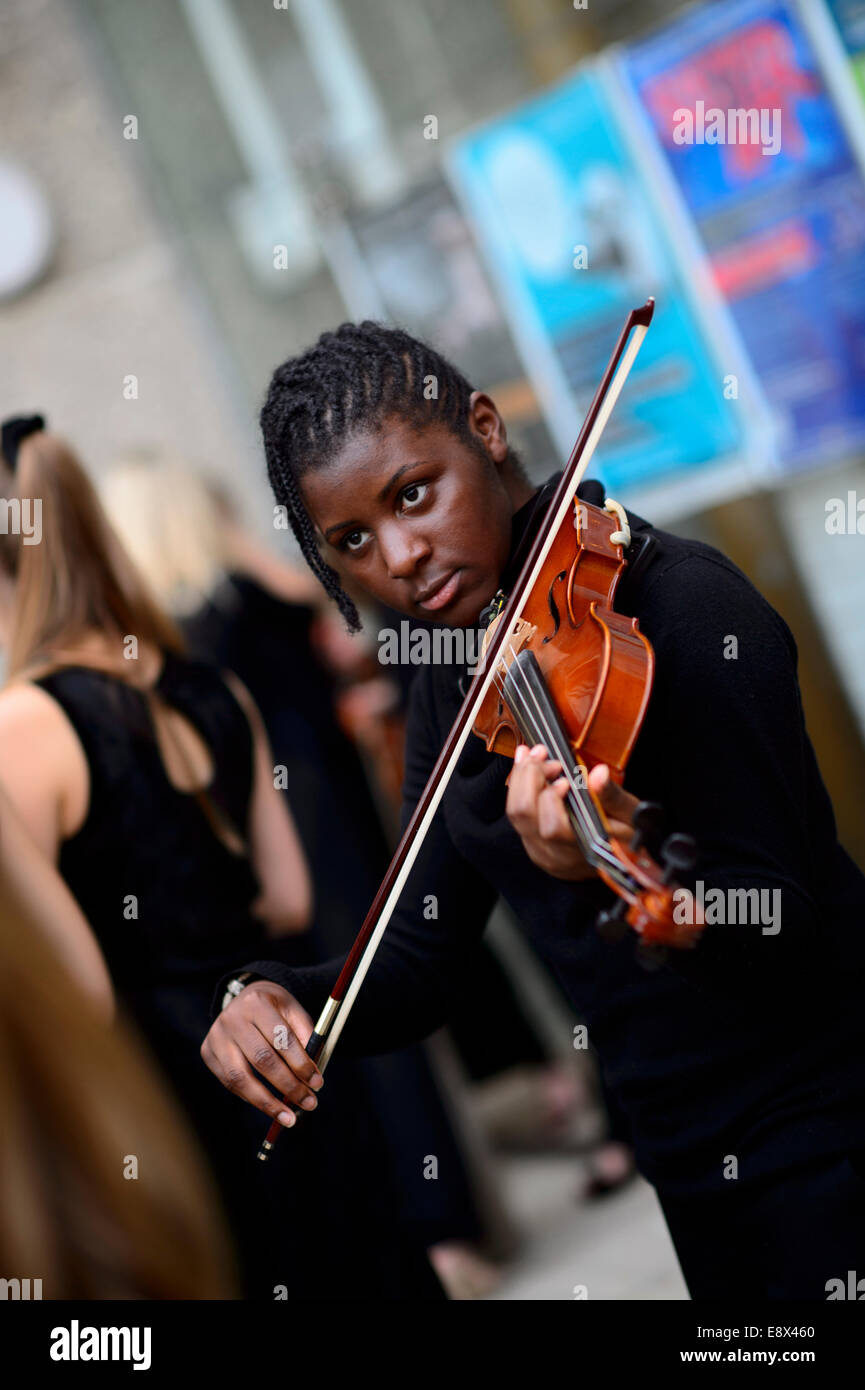 A Young musician violinist of The London Schools Symphony Orchestra preparing to perform at Aberystwyth MusicFest 2014 Stock Photo