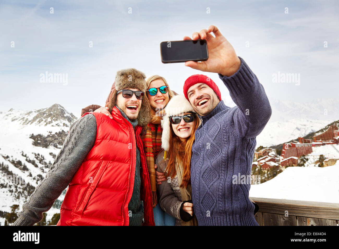 Friends taking picture together in the snow Stock Photo