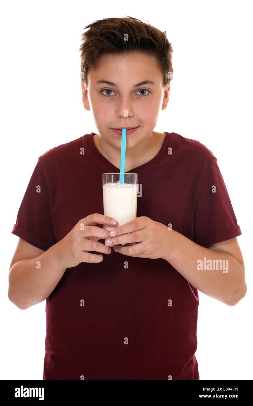 Healthy eating young teenager boy drinking milk, isolated on a white background Stock Photo