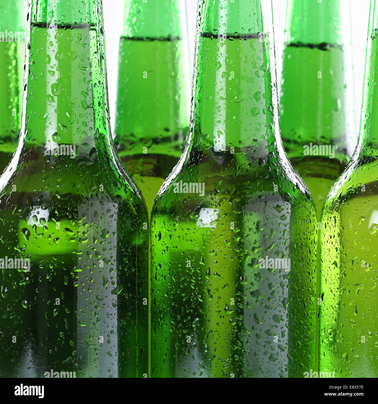 Cold alcohol beer drinks in bottles with water drops Stock Photo