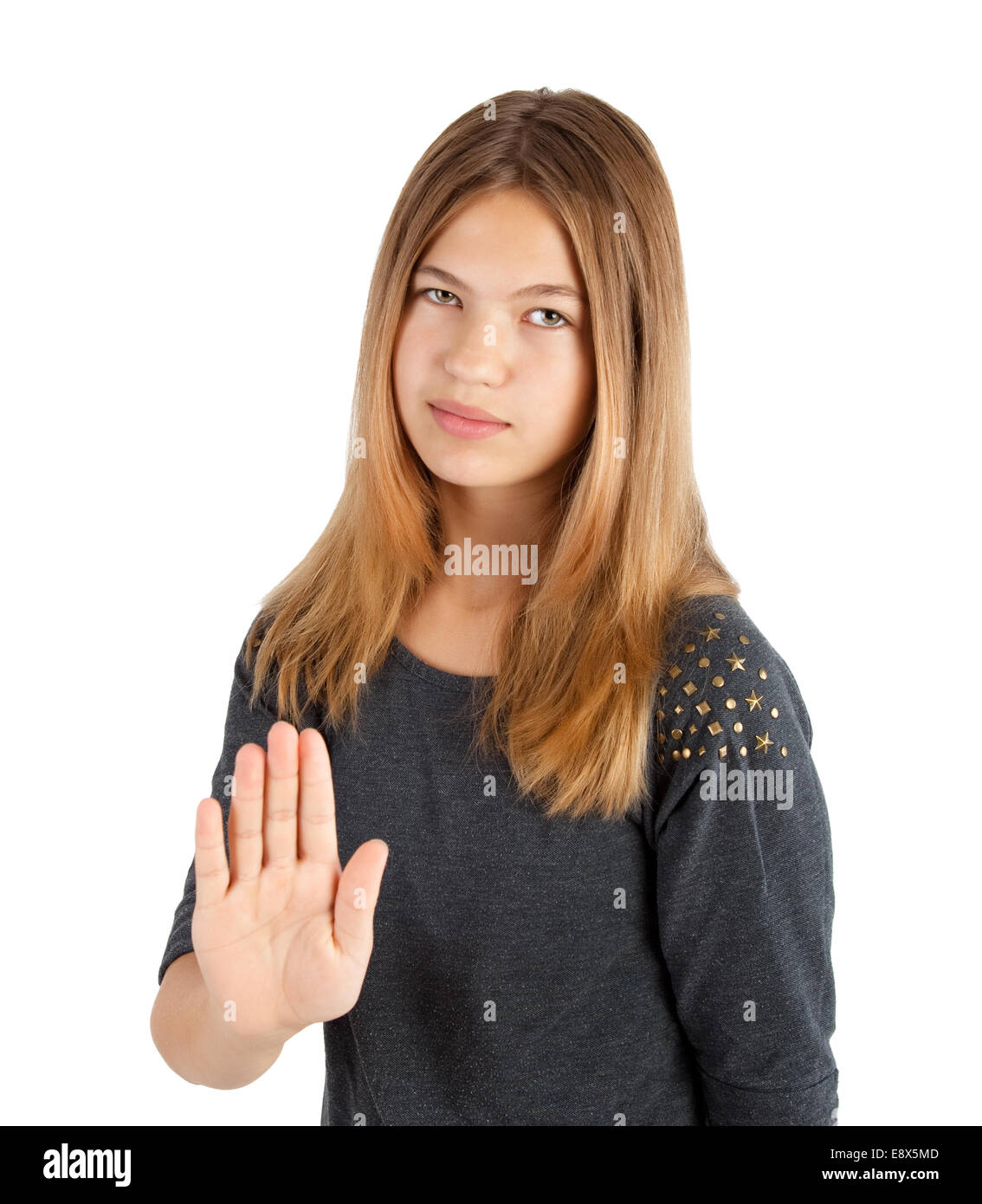 young girl making stop gesture on white background Stock Photo