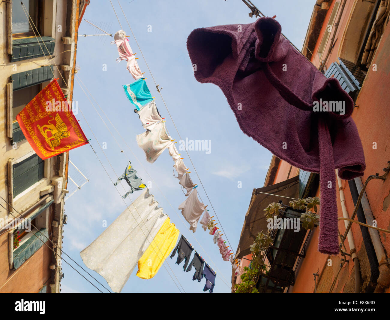 Washing drying on clothes lines in an alley in Venice, Italy Stock