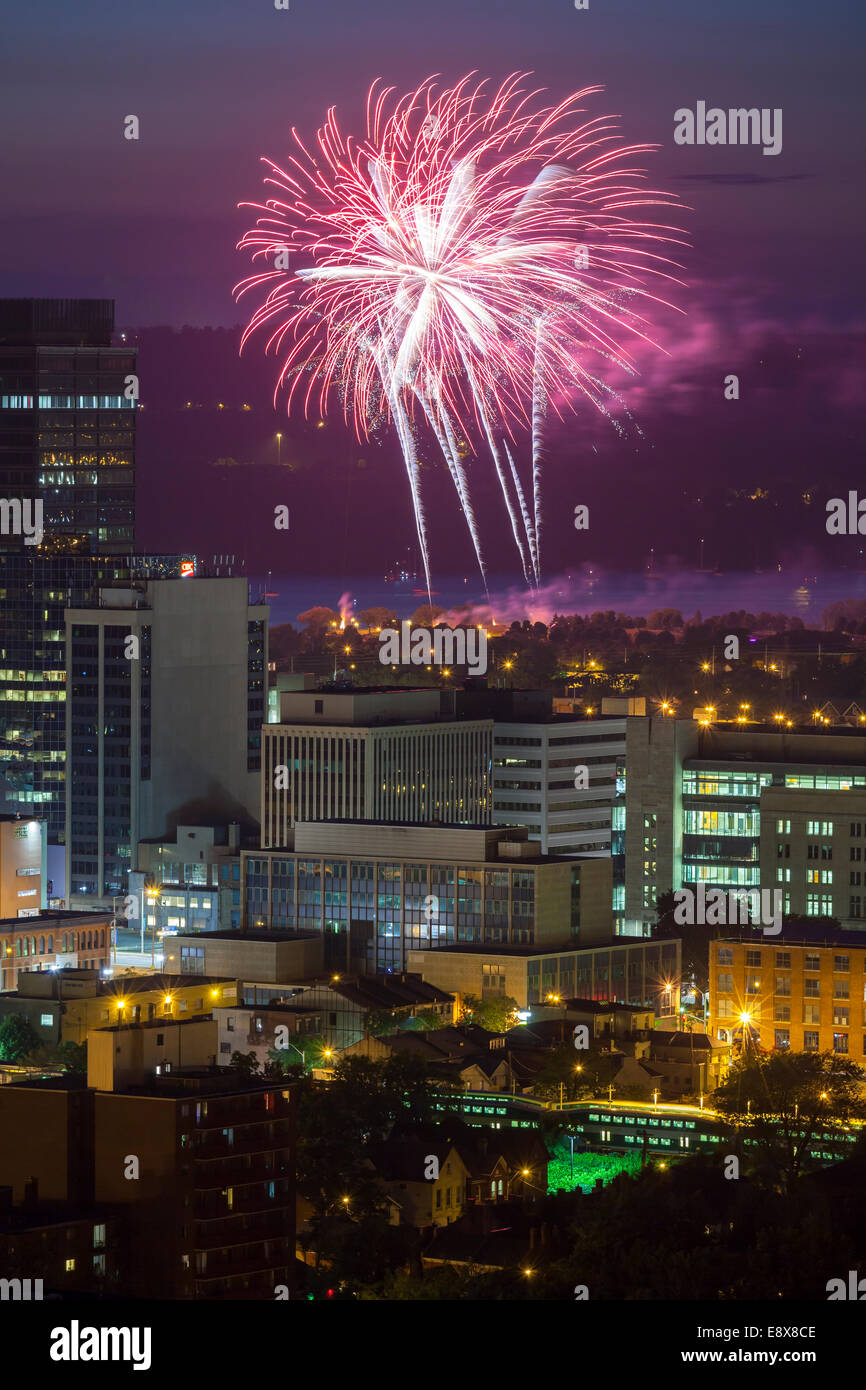 Fireworks over downtown Hamilton and Lake Ontario looking north from the escarpment, Ontario