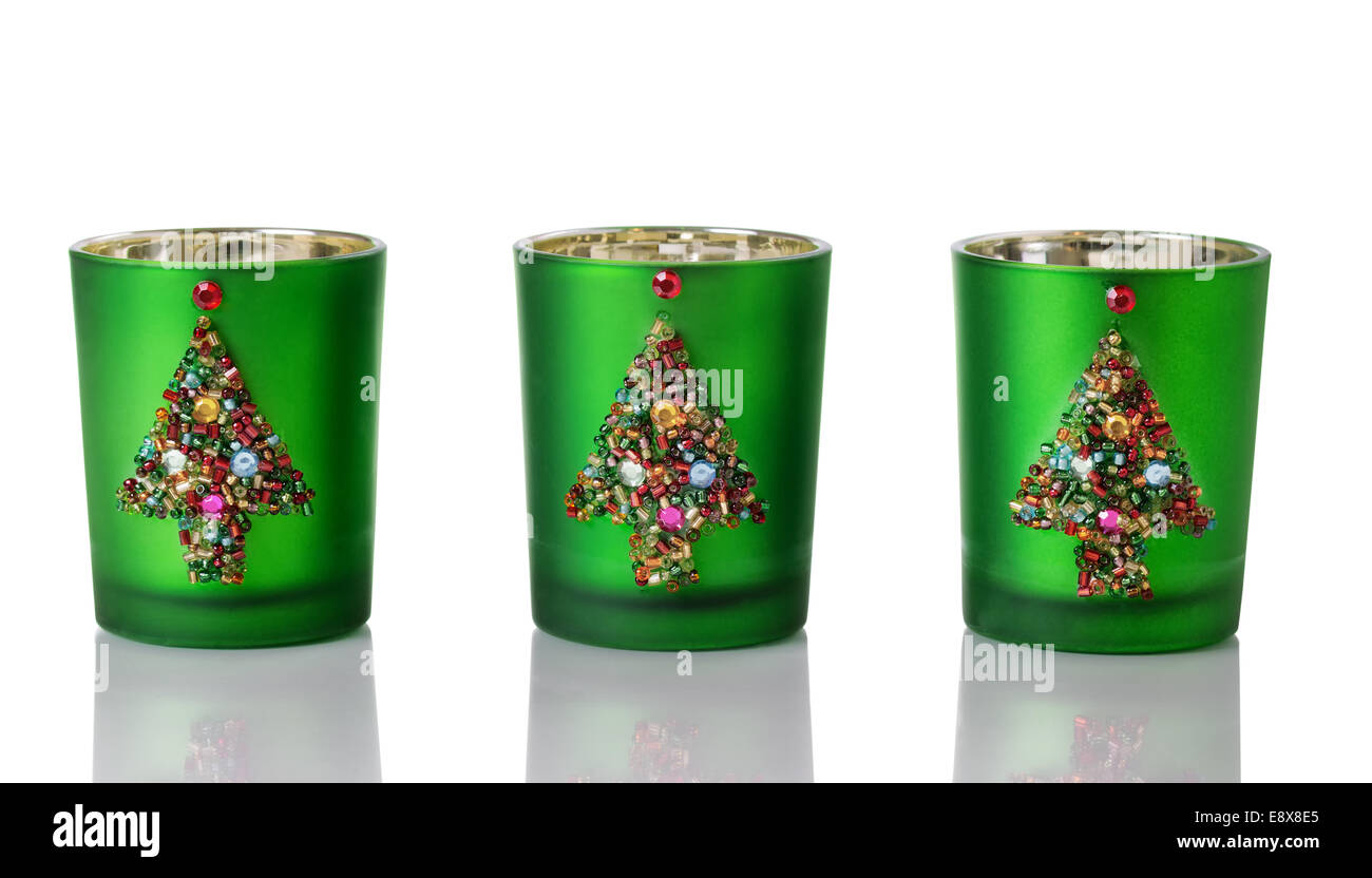 Image of handmade Christmas candle holders on white with reflections