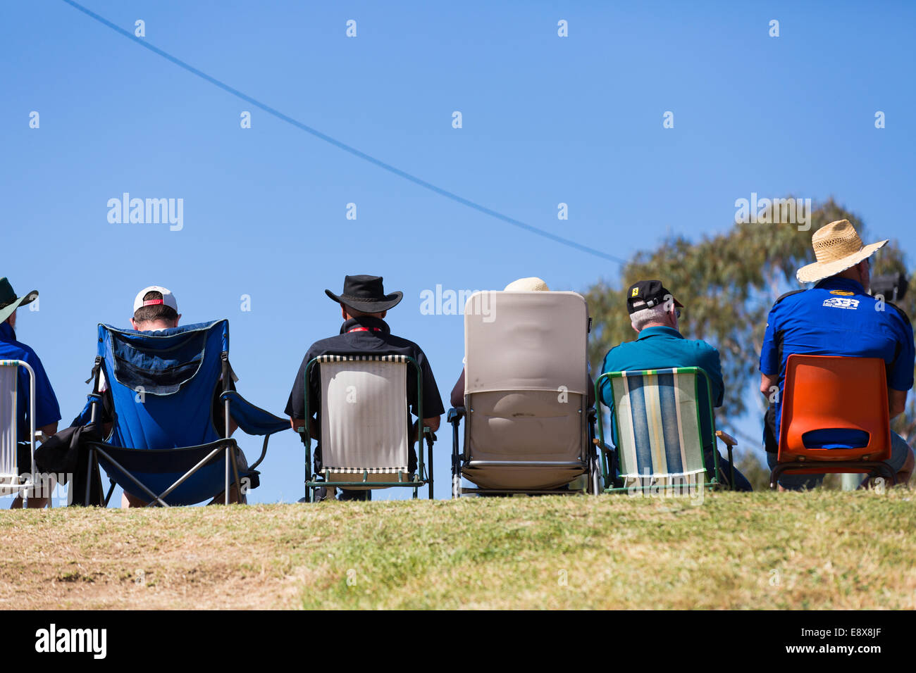 A slightly abstract picture of spectators waiting for the action to start at a motorsport race meeting Stock Photo