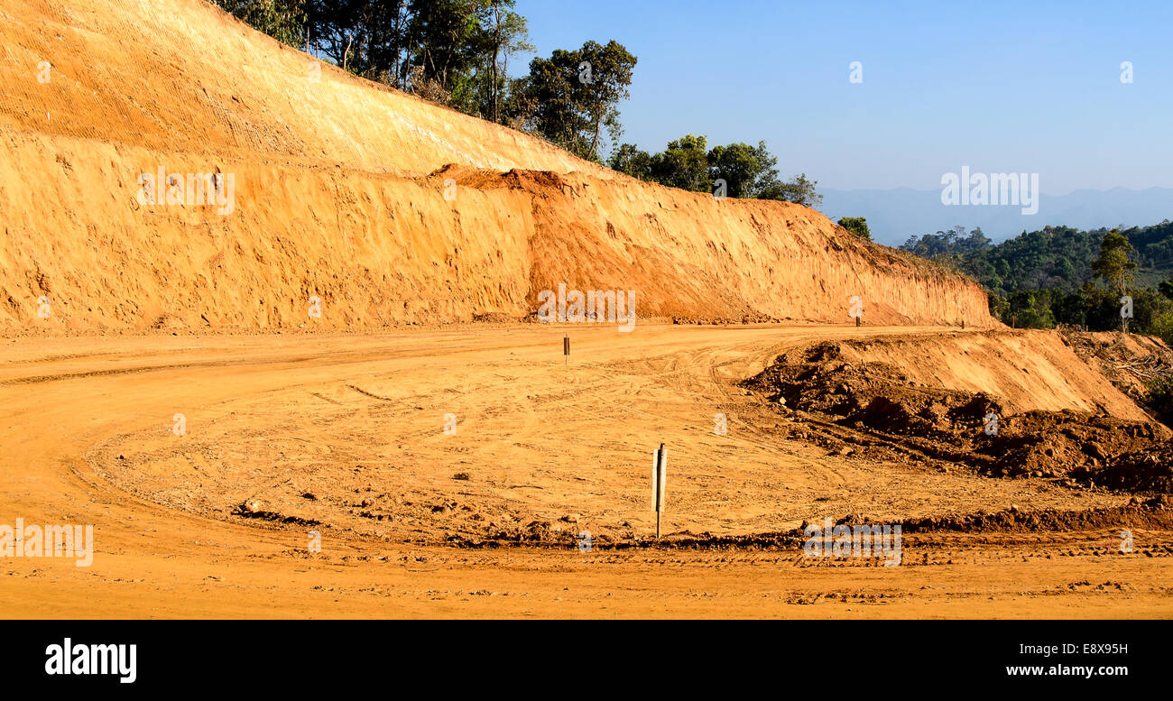 The Laterite Non-asphalt Road Under Construction in the north of Thailand. Stock Photo