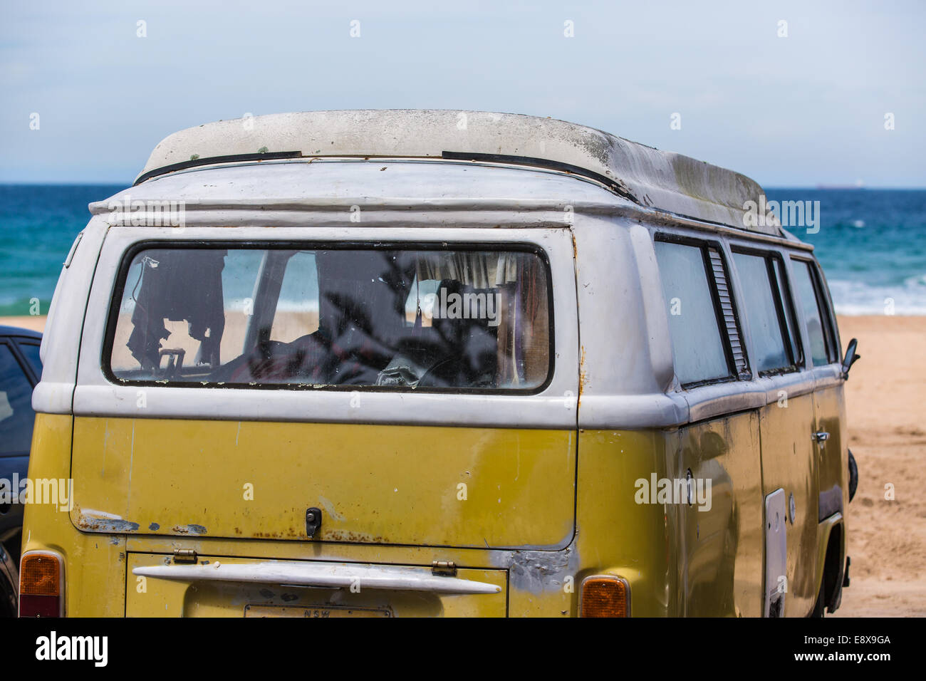 An old 1970's Volkswagen Campervan photographed parked at an Australian Beach Stock Photo