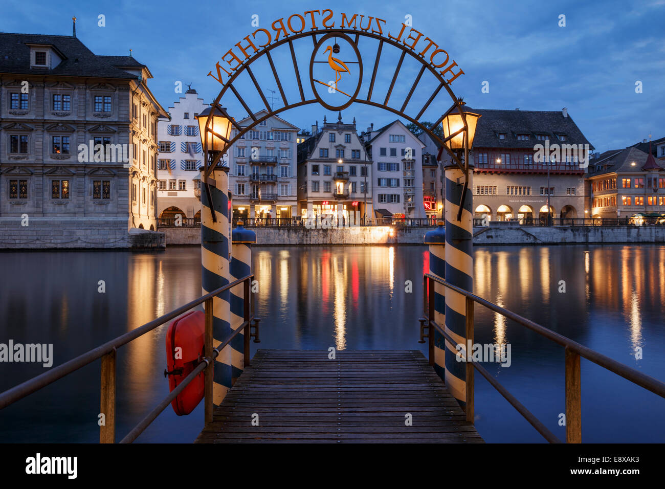 Pier Hotel zum Storchen and Limmat river at night, Zurich, Switzerland. Stock Photo