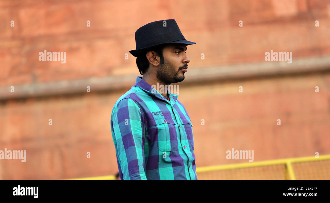 male,wearing hat,tourist,New Delhi,modern,well-dressed,bespectacled. Stock Photo