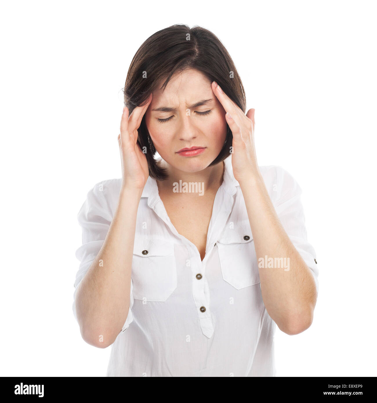 Portrait of young brunette suffering from headache, isolated on white Stock Photo