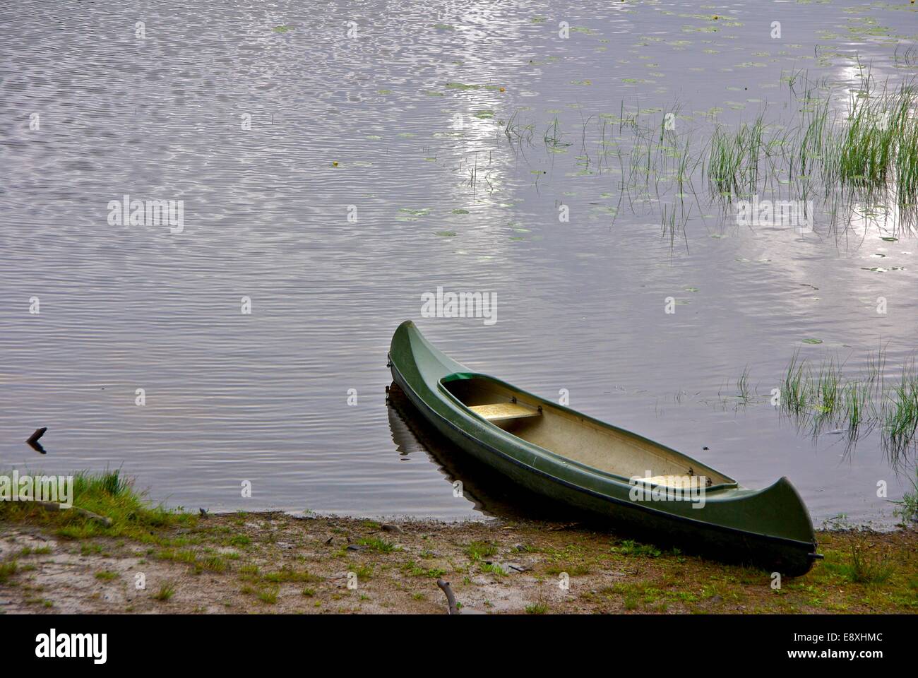 Solitary canoe Stock Photo