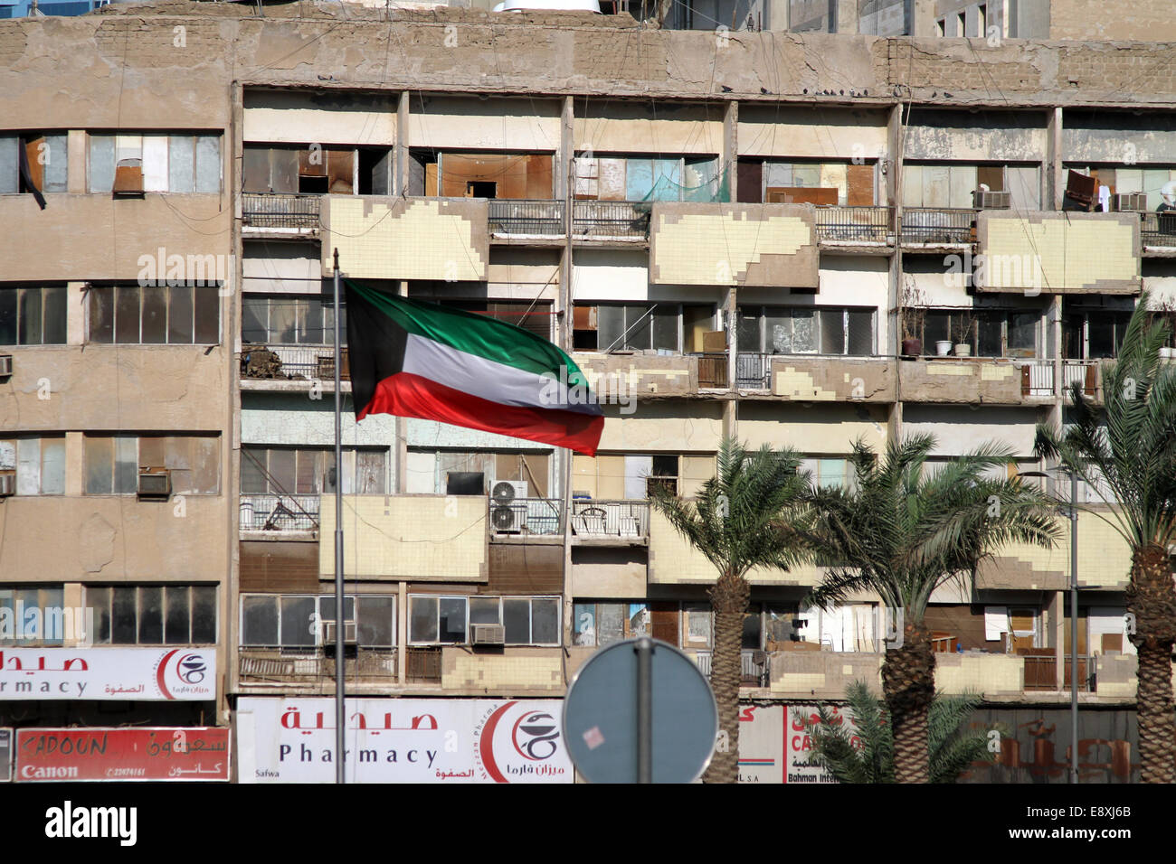 A Kuwaiti Flag Flies In Front Of Apartments In The Centre Of Kuwait City Kuwait Stock Photo Alamy