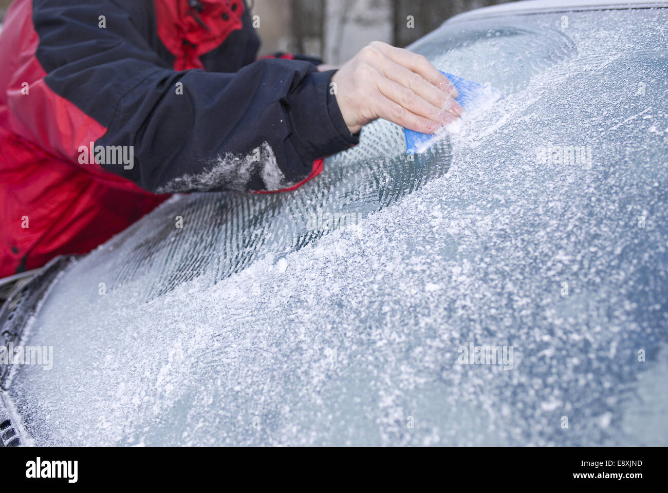 Scraping ice from the windshield Stock Photo