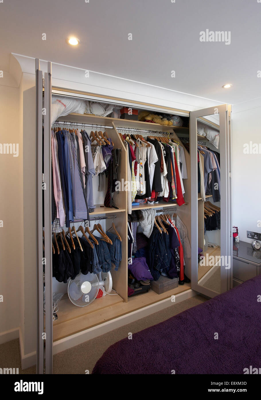 An open wardrobe in a bedroom in a home in the UK Stock Photo - Alamy
