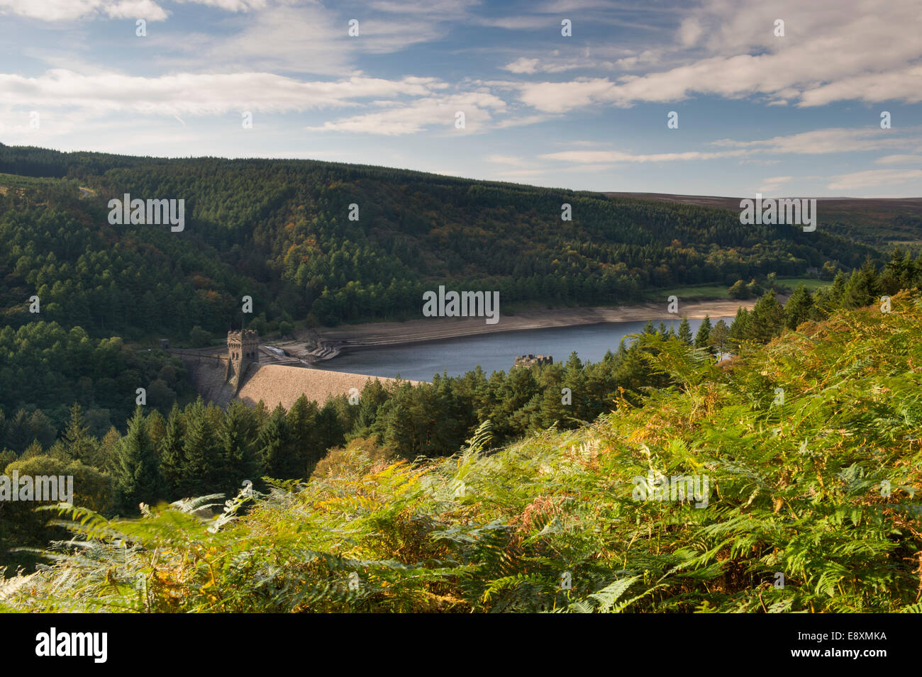 High view over picturesque man-made lake (Derwent Reservoir), dam & trees on wooded hillside slopes on a sunny day - Peak District, Derbyshire, UK. Stock Photo