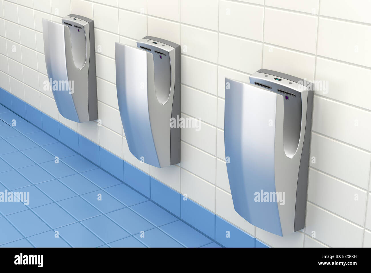 Vertical high speed hand dryers in public washroom Stock Photo - Alamy