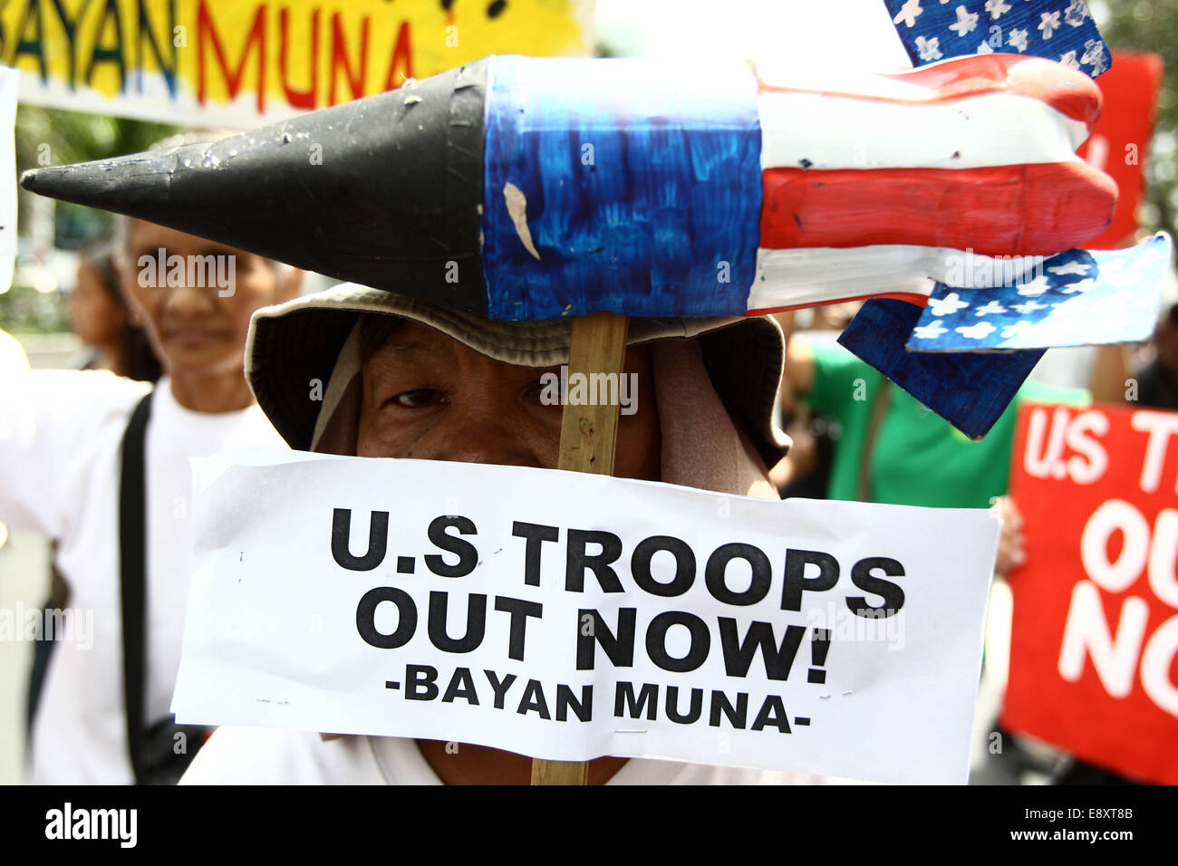 Manila, Philippines. 16th Oct, 2014. An activist holds a placard calling for the junking of the Visiting Forces Agreement during a protest rally in front of the US Embassy in Manila, Philippines, Oct. 16, 2014. The protesters demand justice for Jeffrey Laude, who was suspected to be killed by US Marine Joseph Scott Pemberton last Saturday in Olongapo City. Credit:  Rouelle Umali/Xinhua/Alamy Live News Stock Photo