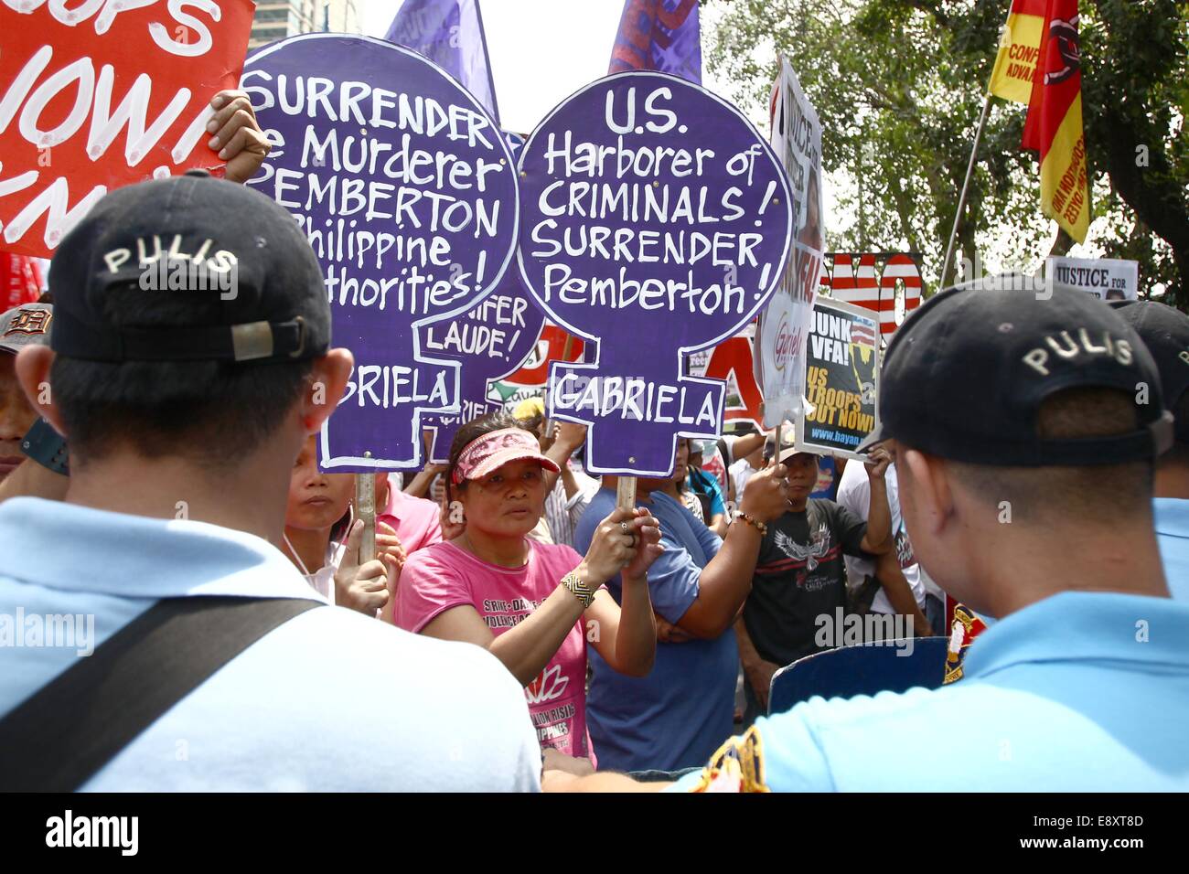 Manila, Philippines. 16th Oct, 2014. Activists hold placards during a protest rally in front of the US Embassy in Manila, Philippines, Oct. 16, 2014. The protesters demand justice for Jeffrey Laude, who was suspected to be killed by US Marine Joseph Scott Pemberton last Saturday in Olongapo City. Credit:  Rouelle Umali/Xinhua/Alamy Live News Stock Photo