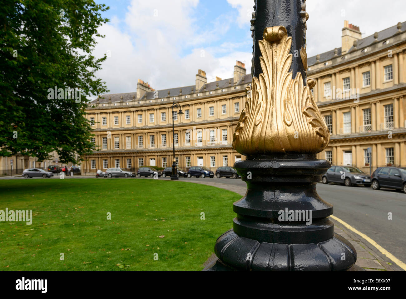 foreshortening of curved Georgian classic residential buildings in city center, in foreground gilt lamppost base Stock Photo
