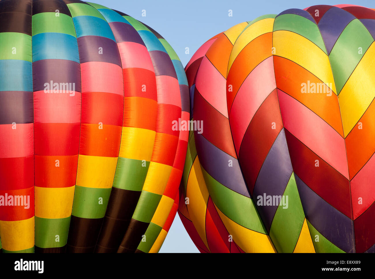 Hot air balloons bumping during inflation Stock Photo