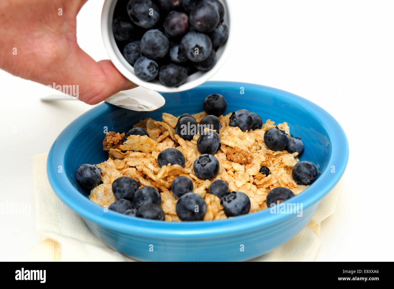 Pouring Blueberries On Cereal Stock Photo Alamy