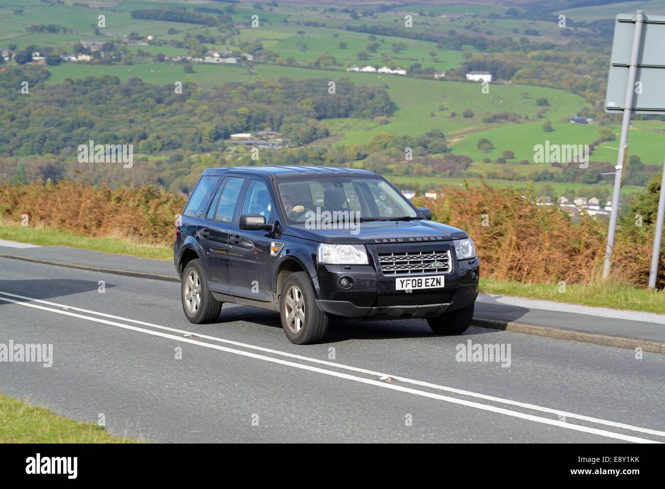 A Land Rover Freelander driving up a hill on Ilkley Moor, West Yorkshire Stock Photo