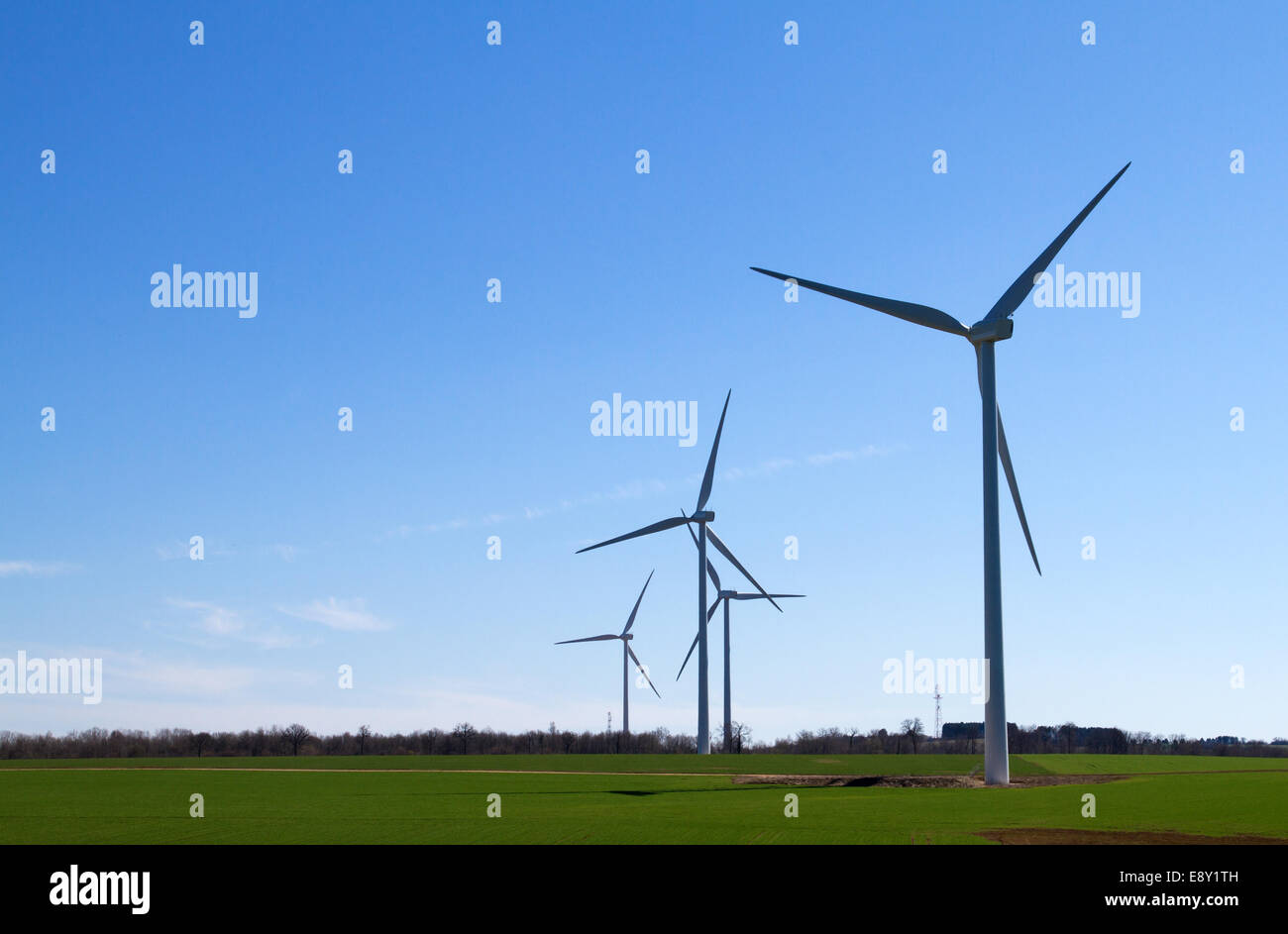 Wind turbine on clear blue sky Stock Photo - Alamy