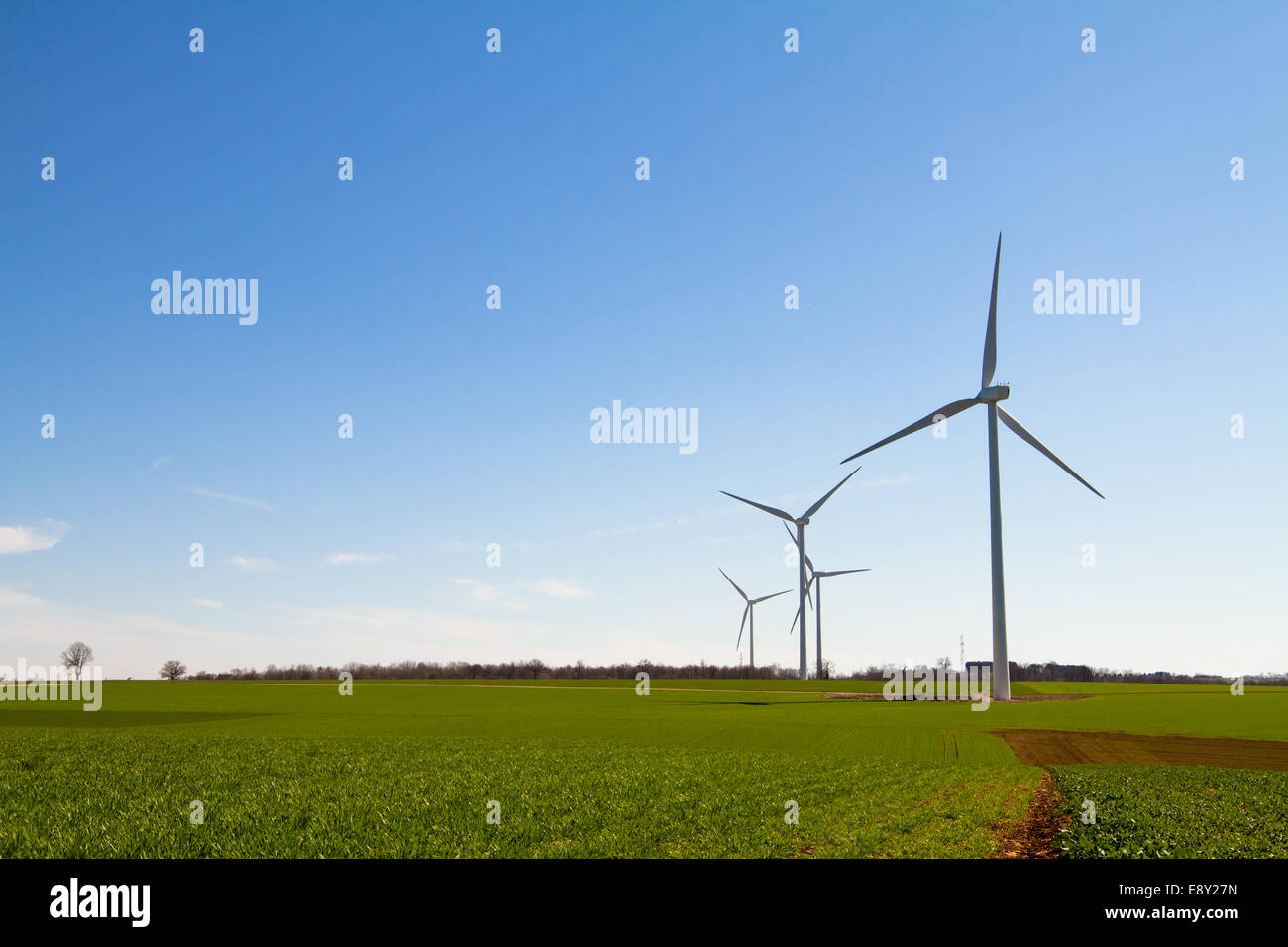 Wind turbine on clear blue sky Stock Photo - Alamy