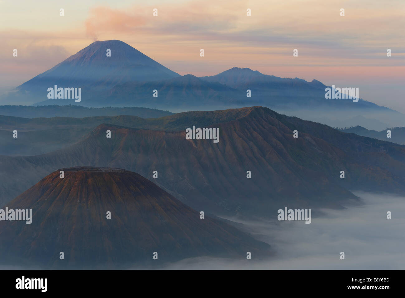 Sunrise over the smoking Gunung Bromo volcano, Bromo-Tengger-Semeru National Park, Java, Indonesia, Asia Stock Photo