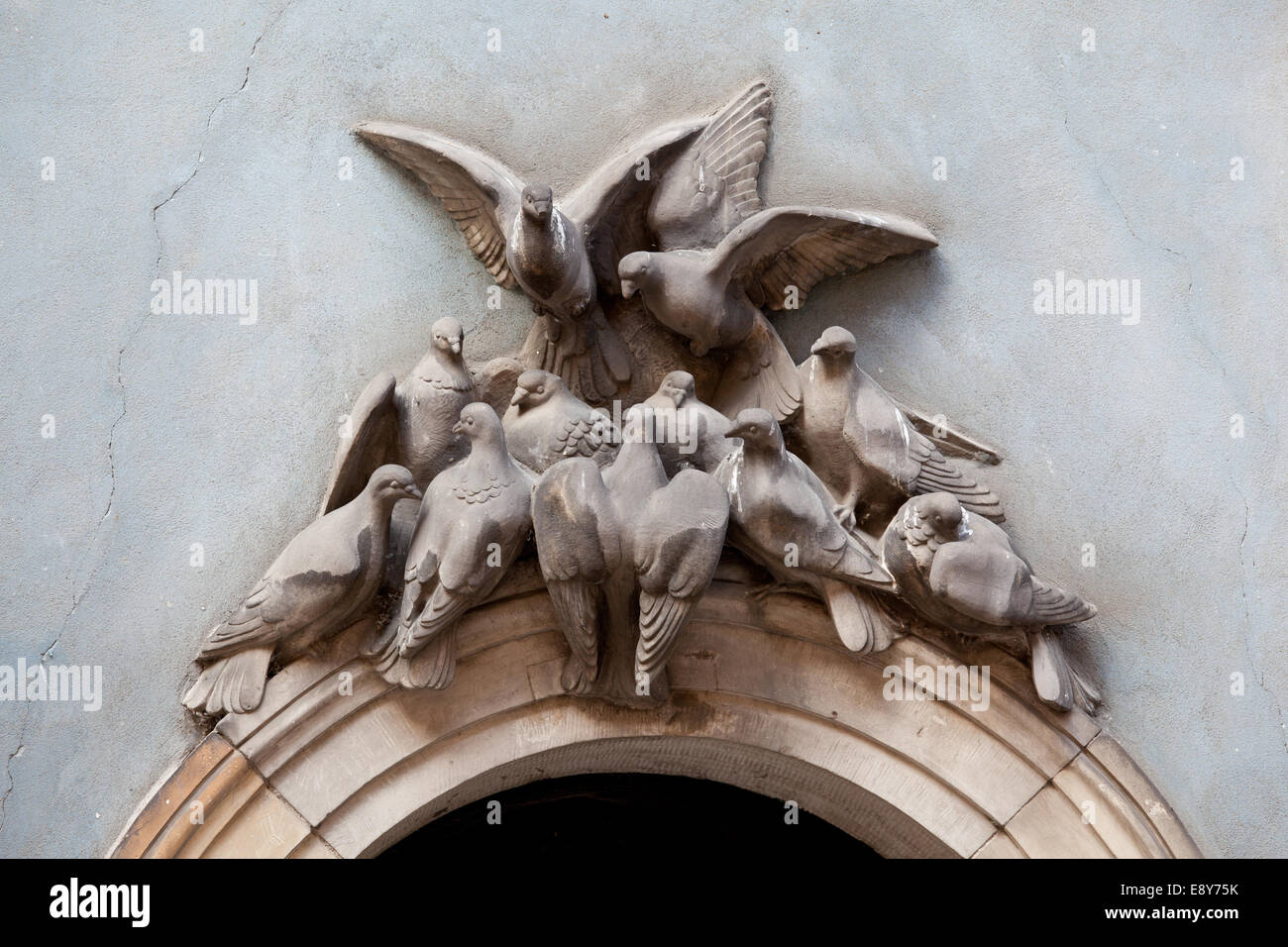 Doves above archway Stock Photo