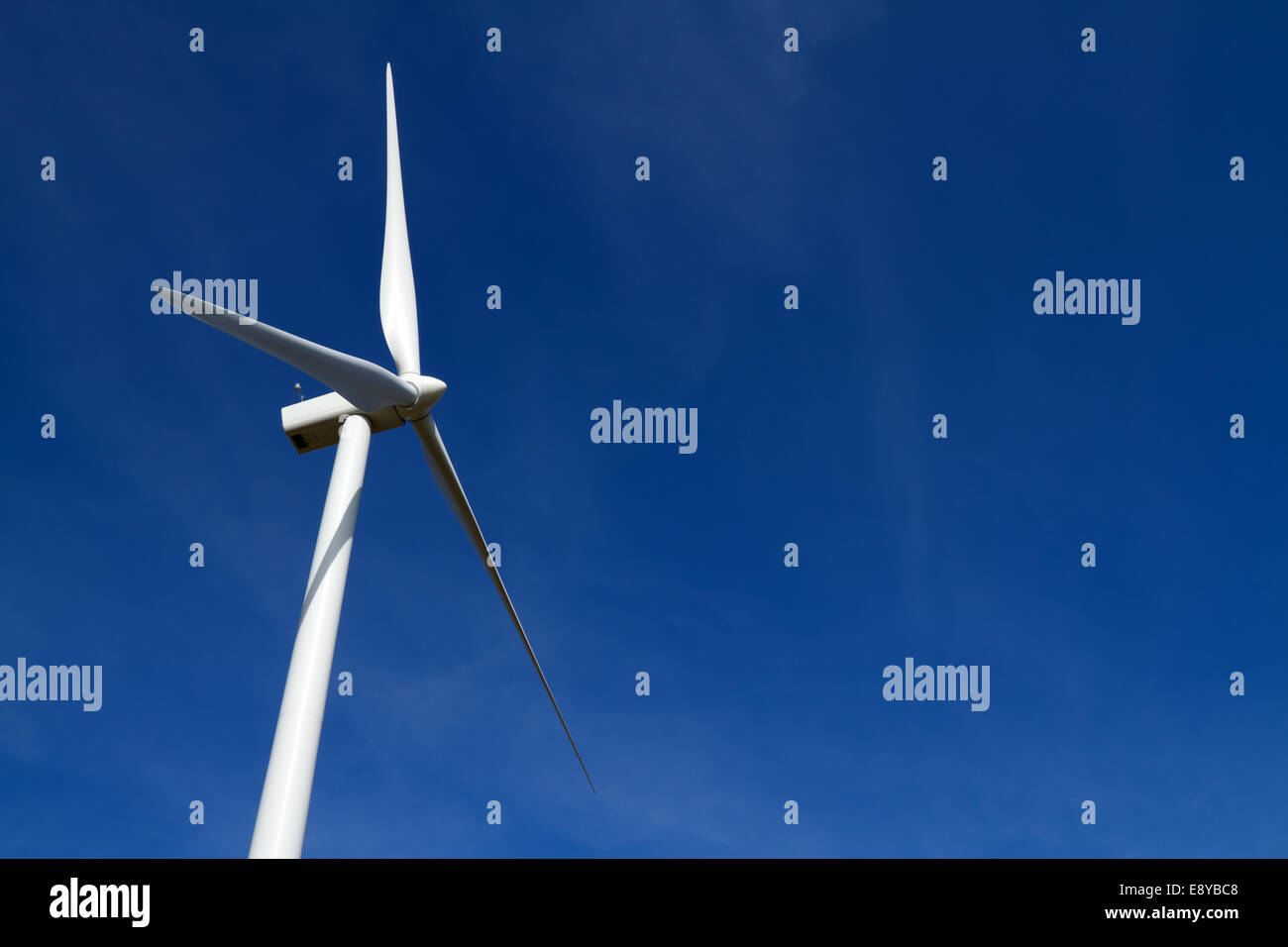 Wind turbine on clear blue sky Stock Photo - Alamy