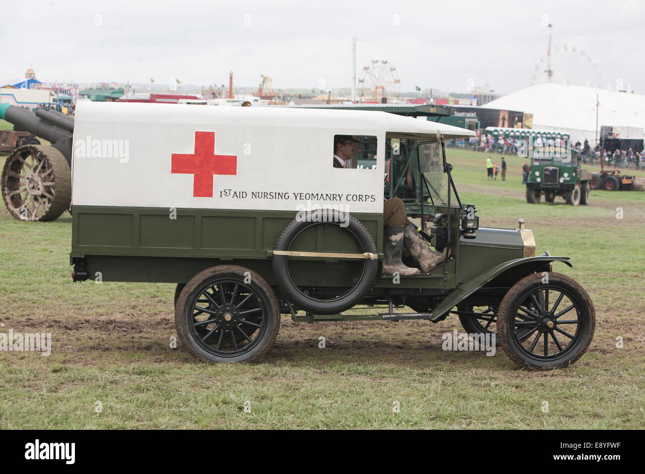 A WW1 Ford medics (Red Cross) truck being driven by people in period uniforms. Stock Photo