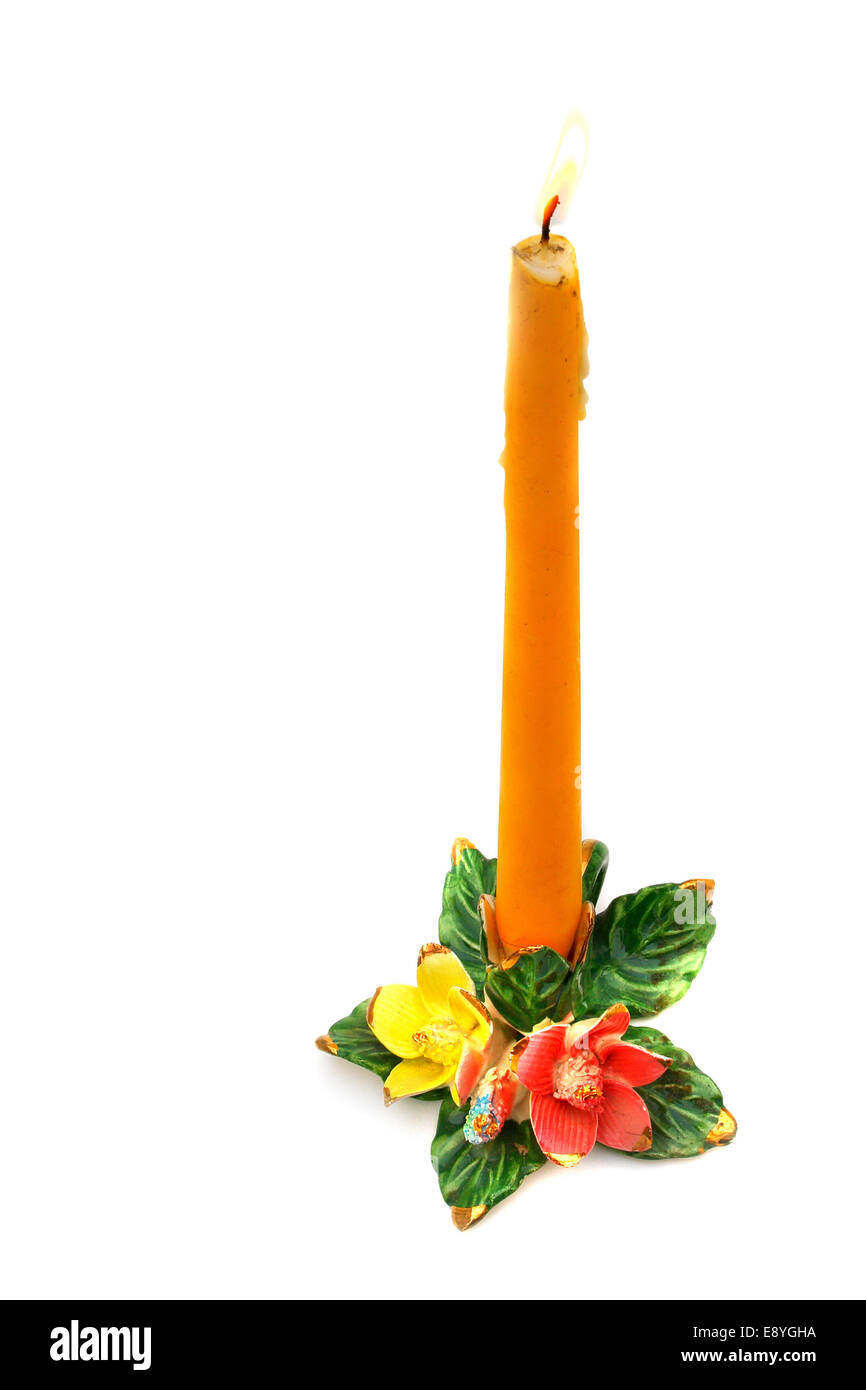 Burning candle in candlestick Stock Photo Alamy